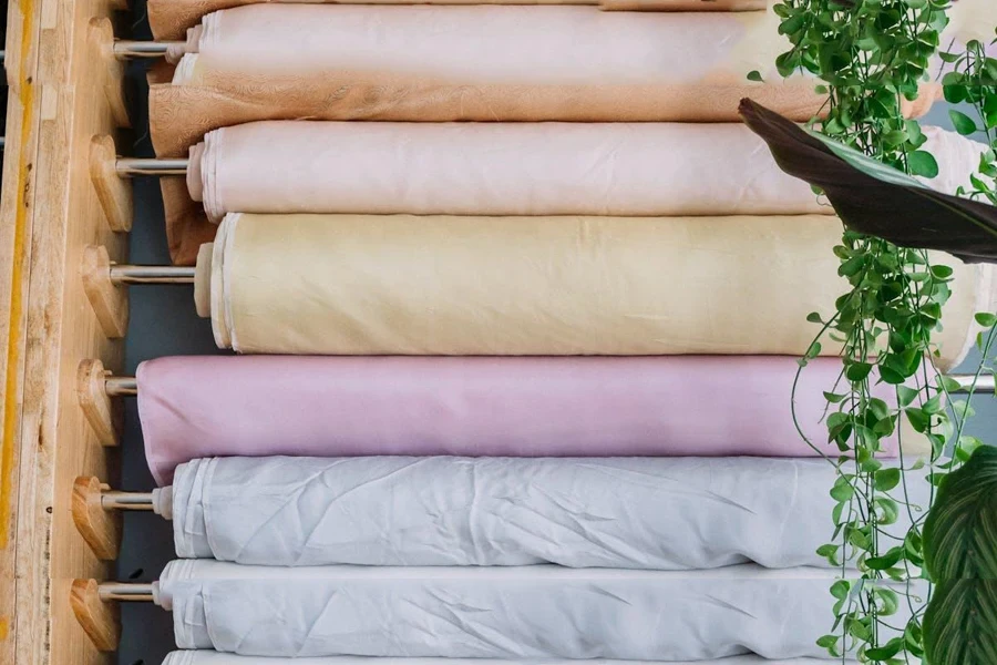 Racks with rolls of fabric in a tailor’s shop