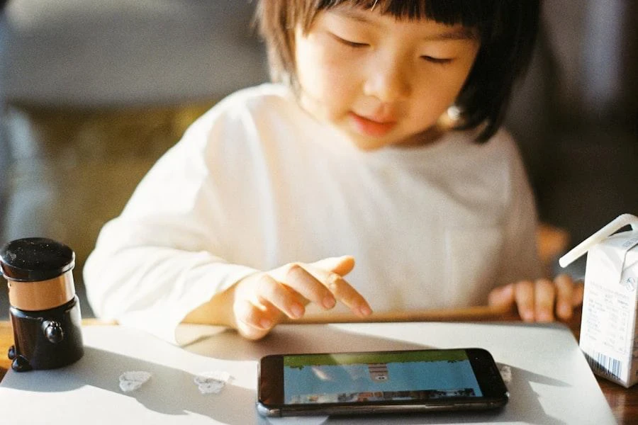 Young child playing a game on a tablet