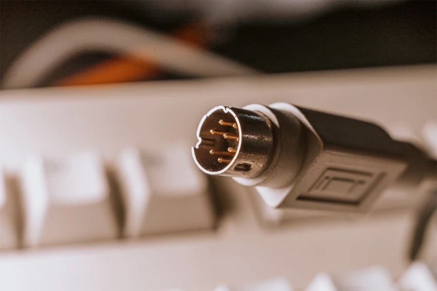 black and silver microphone on white computer keyboard