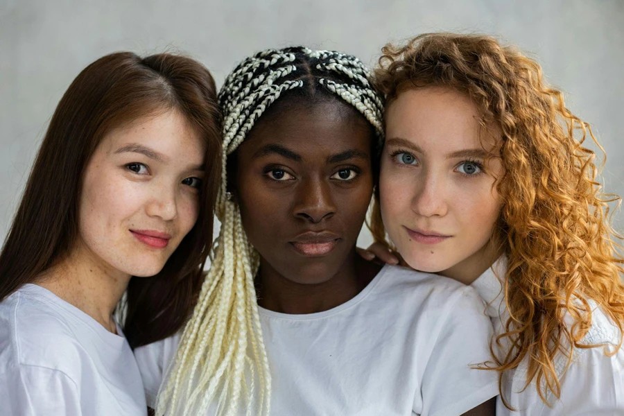 3 Women Wearing White Crew Neck Shirts