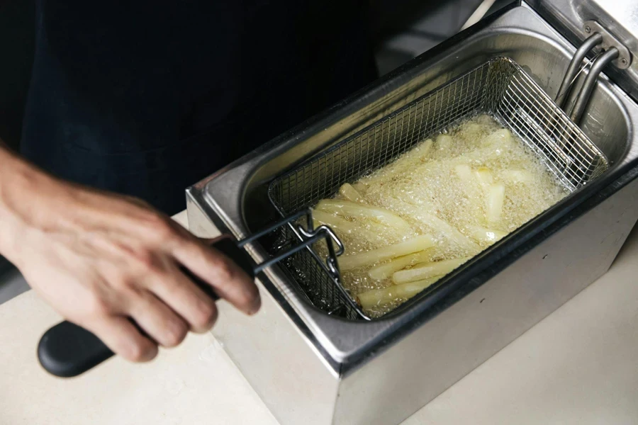 A Person Cooking French Fries