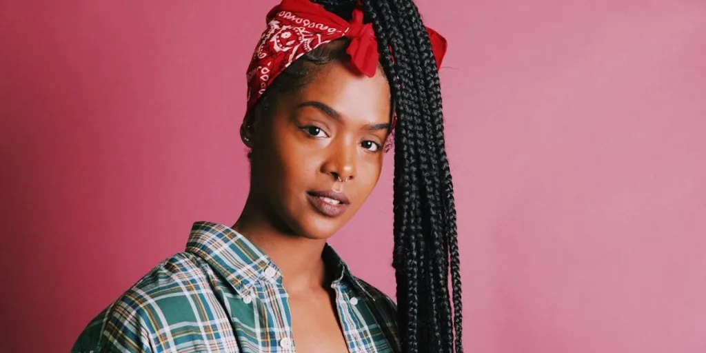 A black woman posing for a selfie