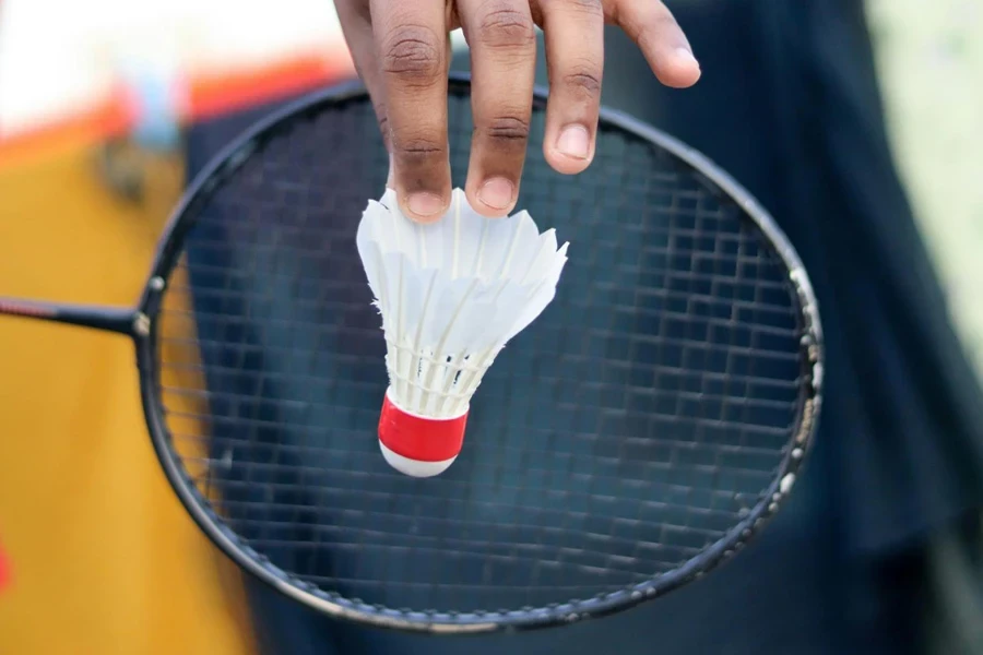 Badminton player holding racket with Badminton Shuttlecock