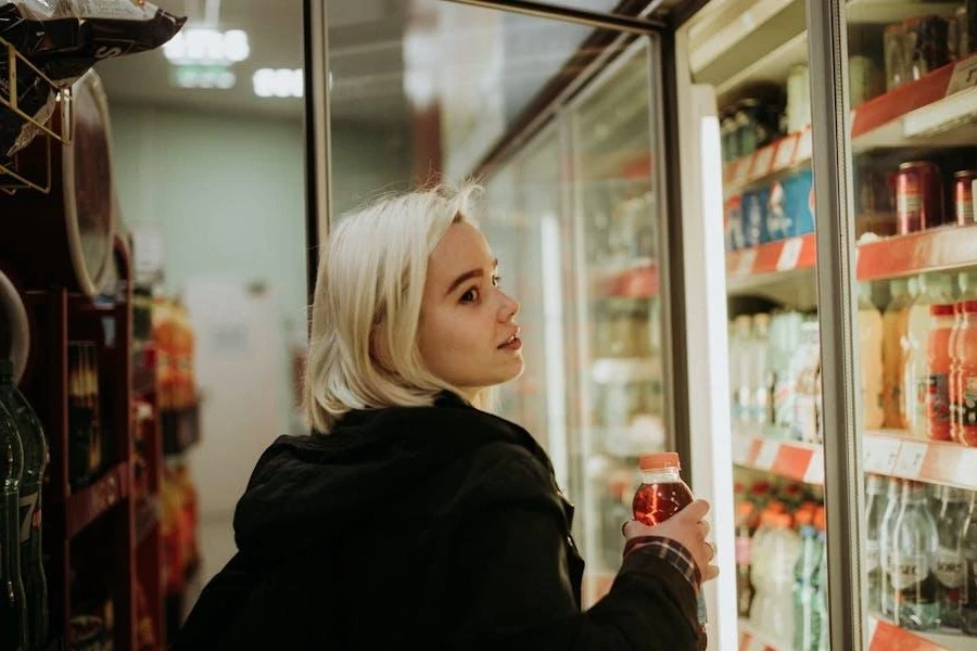 Lady buying a drink from her favorite brand