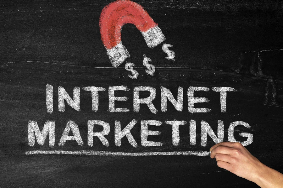 Magnet and internet marketing on a blackboard