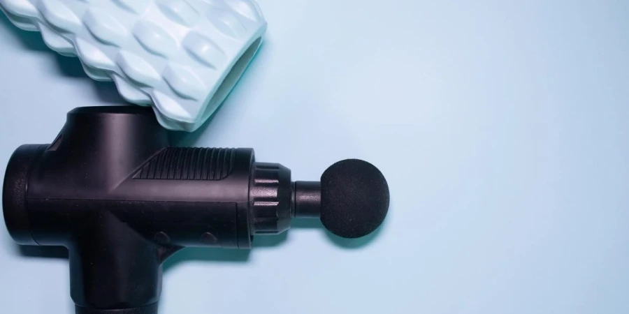 Massage gun on a blue background