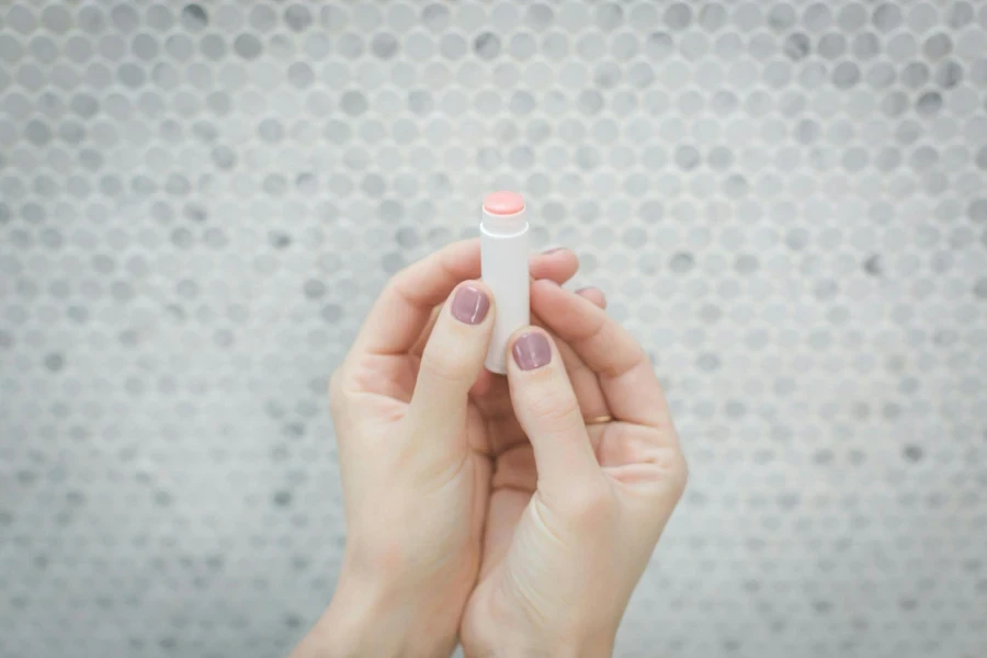 Person Holding a Lip Balm