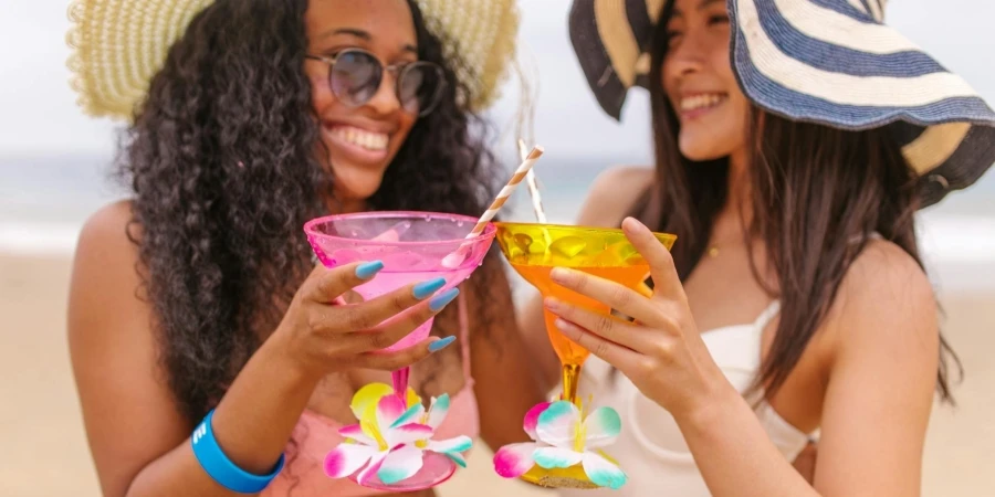 Women Enjoying Cocktail Drinks on the Beach