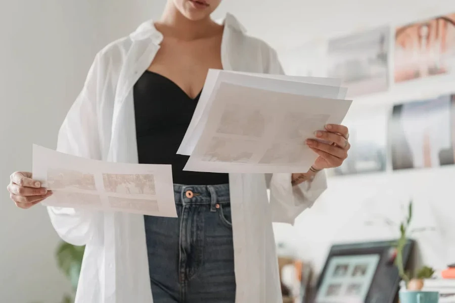 A businesswoman examining sheets of paper