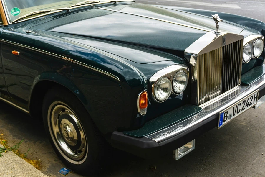 classic black Rolls Royce car parked at roadside