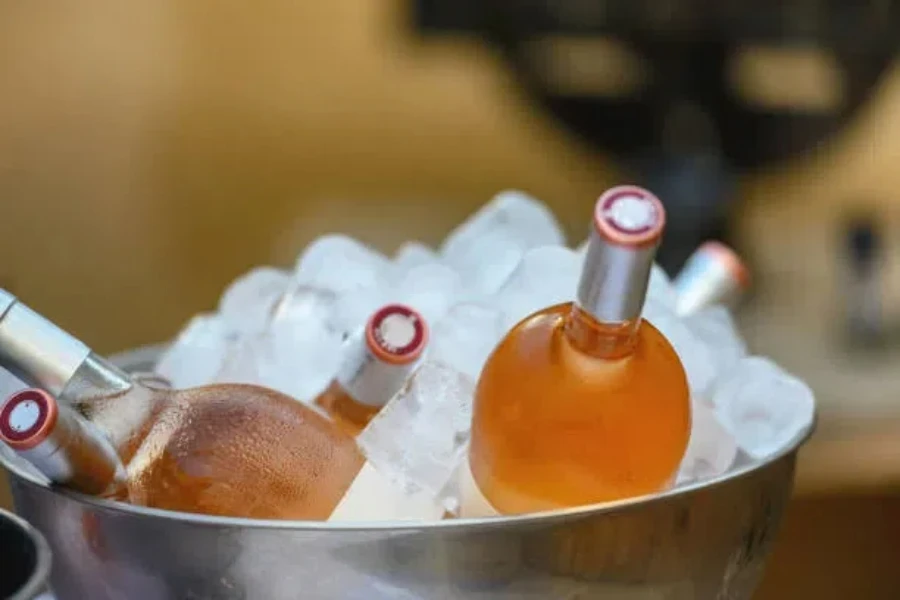 Disco ball style ice bucket with wine bottles inside