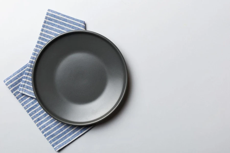 gray plate on tablecloth for food empty