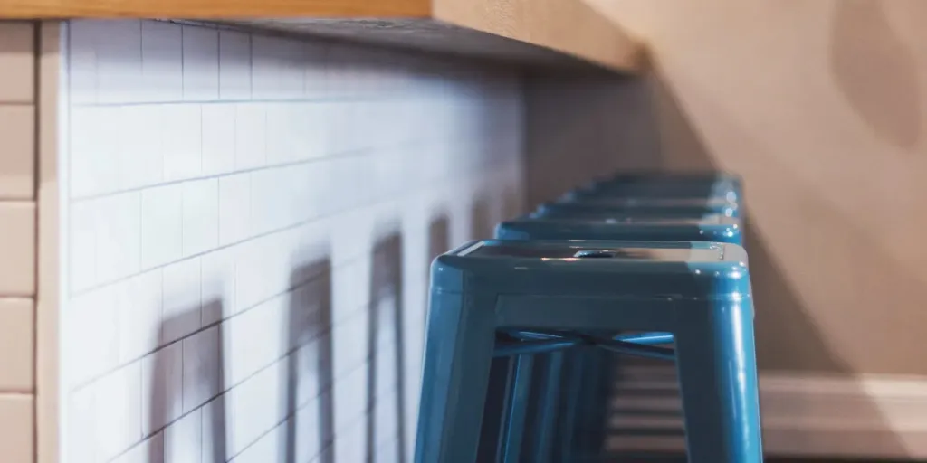 Kitchen counter with backless blue metal stools