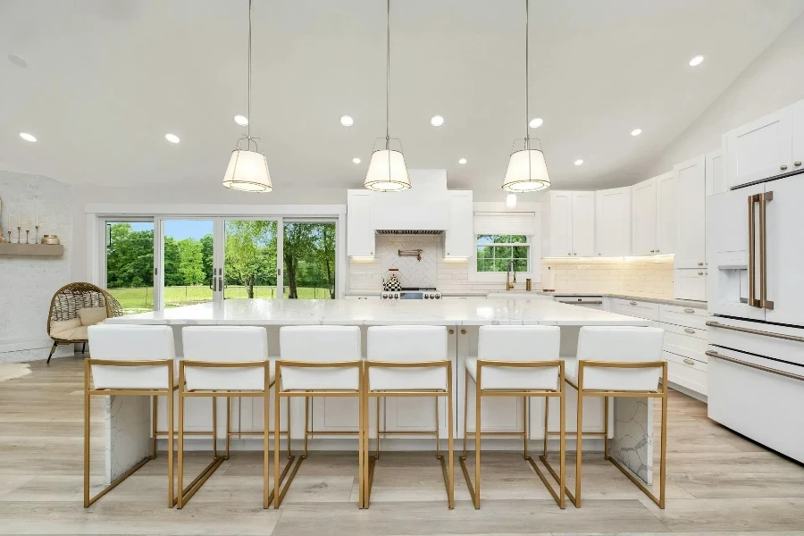 Kitchen island with white and gold modern bar stools