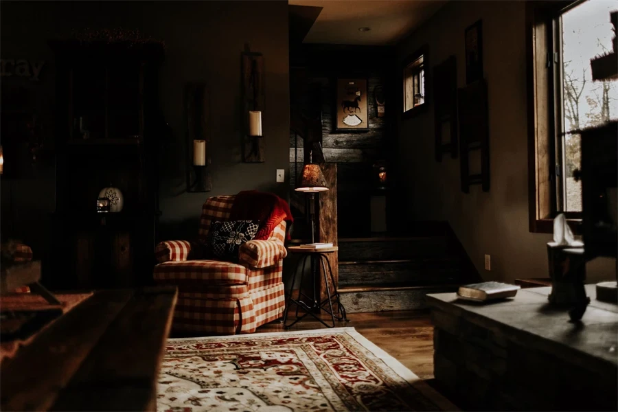 red with white checkered armchair beside rack