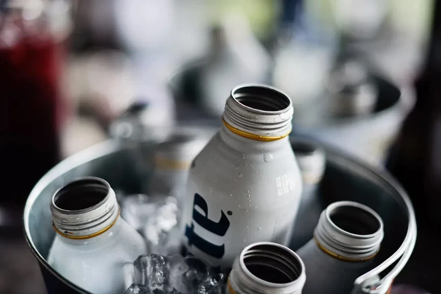 Small metal ice bucket with aluminum bottles inside