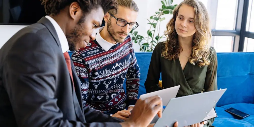 Two business people talking to a marketing consultant