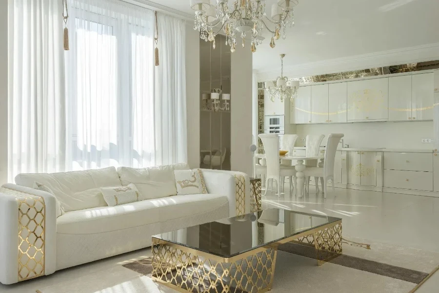 white and gold living room design with white sheer curtains