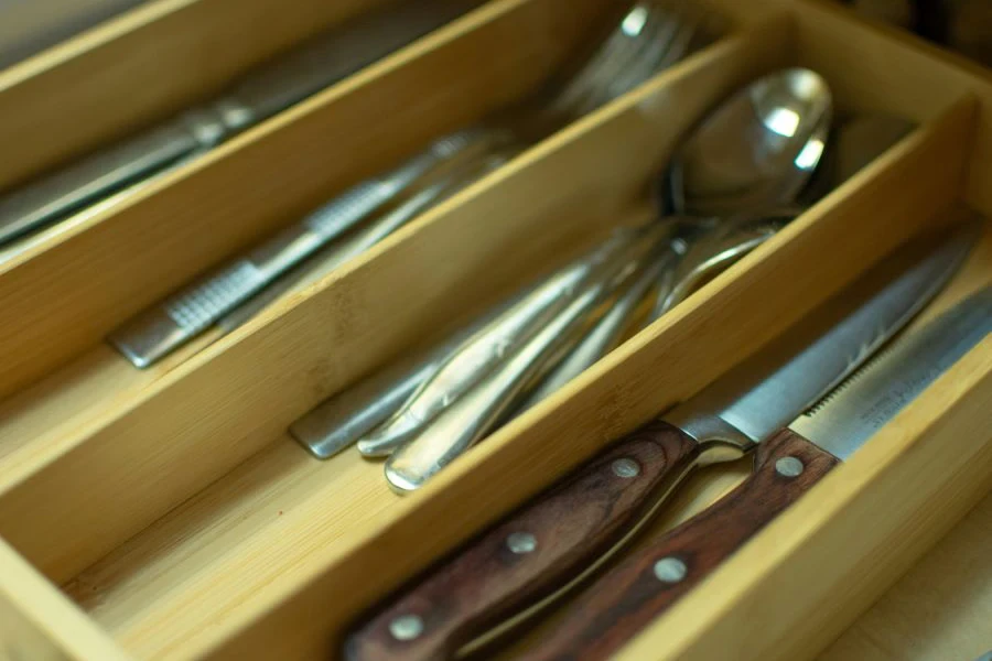 A cutlery drawer organizer with cutlery