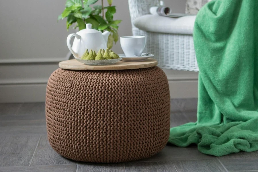 A pouf with a plate of food on it