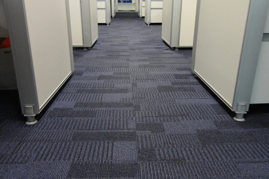 An office installed with dark blue carpet tiles