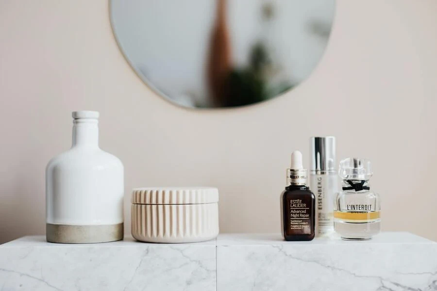 Multiple beauty products on a white surface