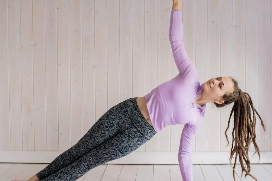 Woman in pink long sleeves doing yoga