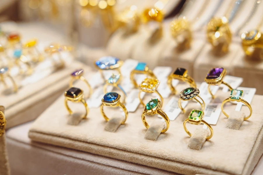 golden rings with gemstones in jewel tones