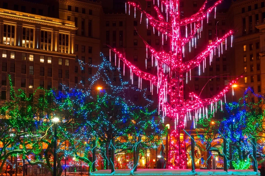 A selection of string and icicle lights on outdoor trees