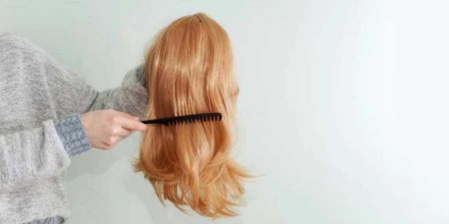 Caucasian Woman Combing Her Red Wig with Comb