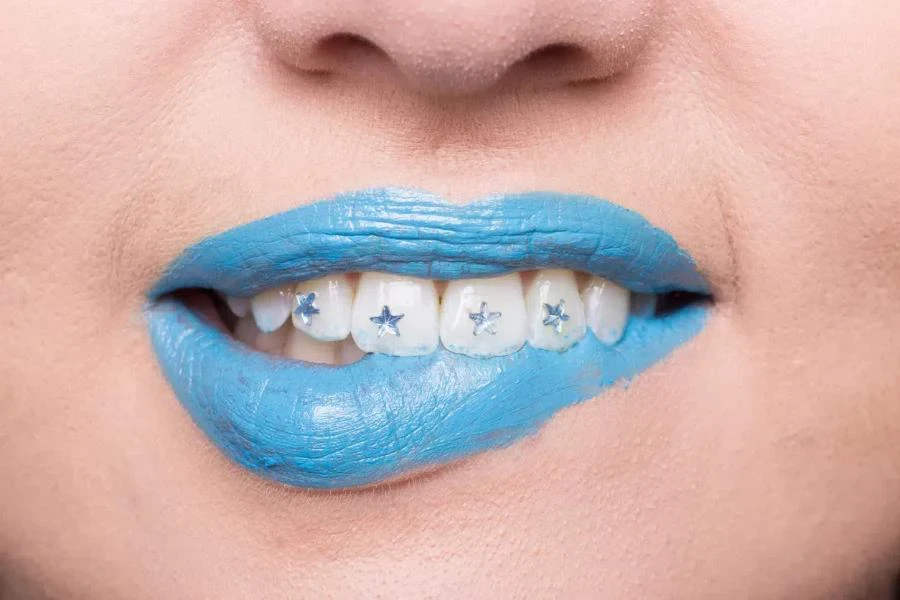 Close-up of person with tooth gems