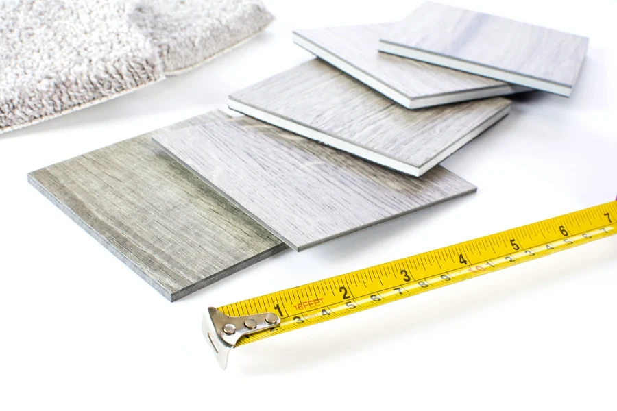 Gray samples of engineered hardwood and carpet samples