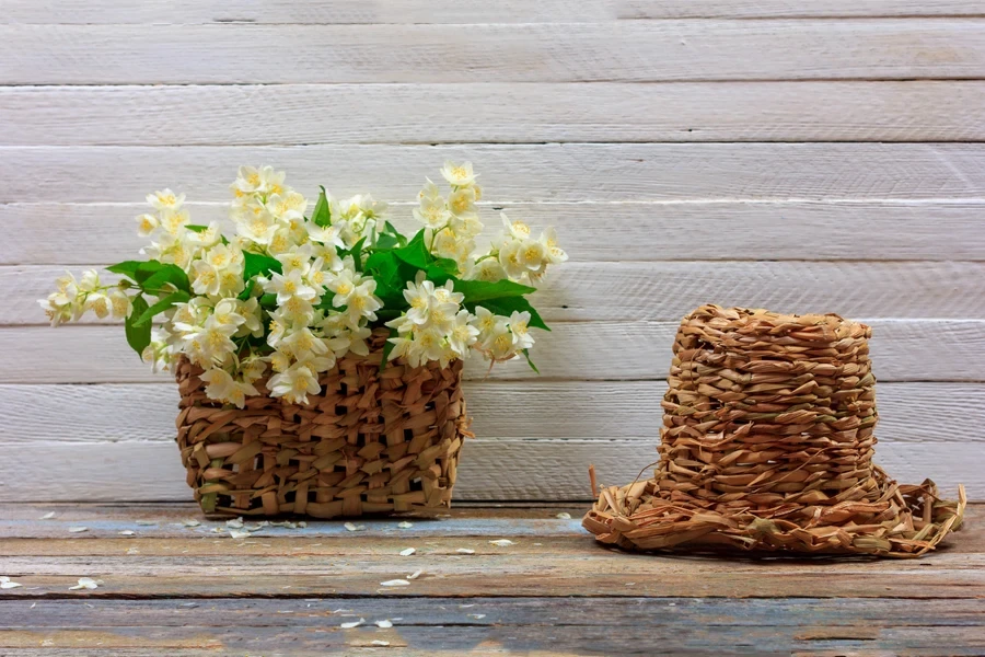 Jasmine flowers in a wicker basket on a table