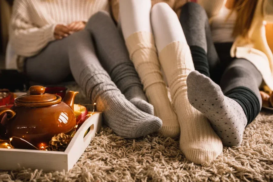 Three ladies wearing warm winter socks