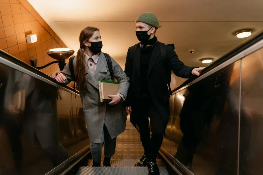 Woman and man in a suit and beanie