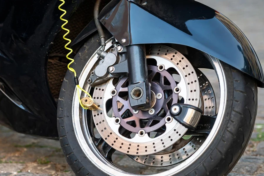 A Motorcycle Wheel with a Lock Attached to Its Disc Brake