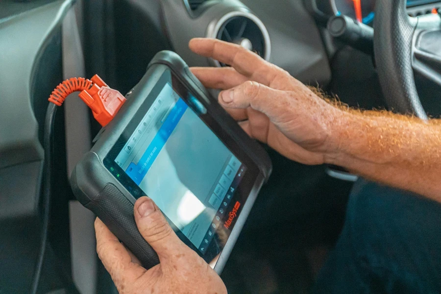 Close-up of Mechanic with Tablet