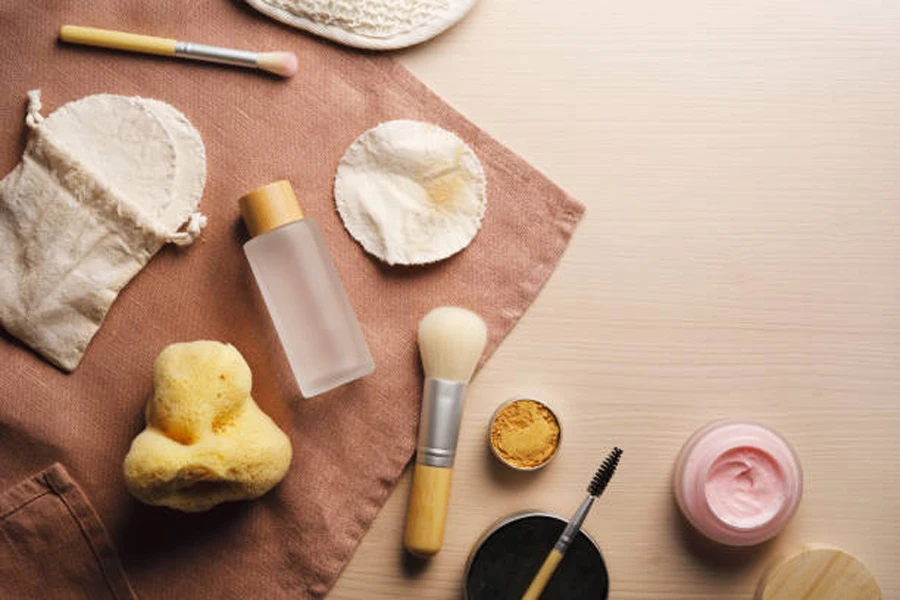 Selection of makeup removal tools, tissue, and creams on table