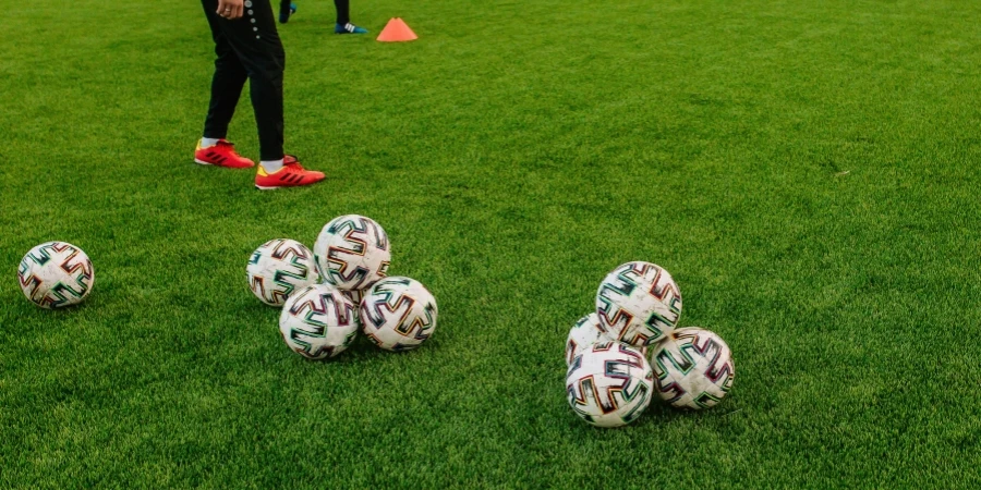 Set of Balls on Green Grass Field