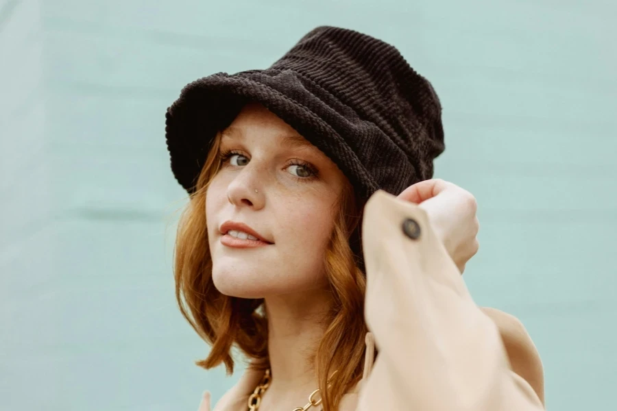 Woman wearing brown cord bucket hat