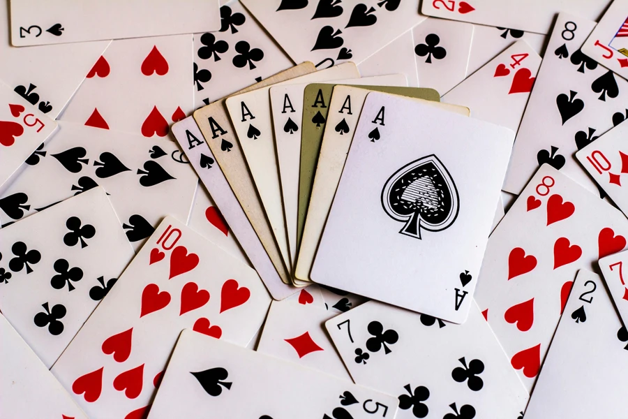 a pile of playing cards sitting on top of each other