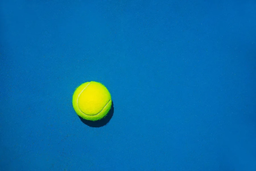 Tennis ball on blue background