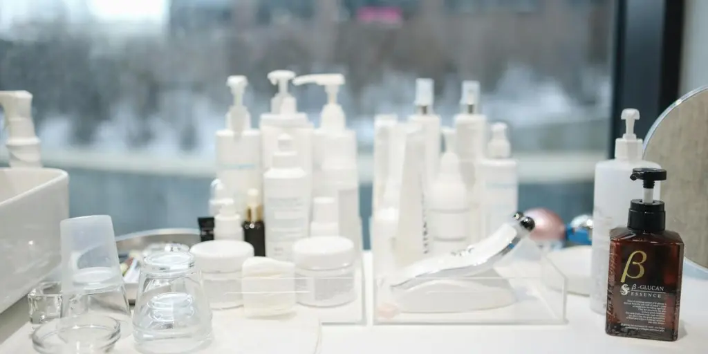 A collection of skincare products on a countertop in a contemporary beauty salon setting