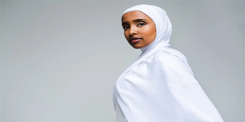 Beautiful arab middle-eastern woman with traditional abaya dress in studio