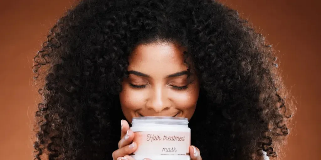 Beauty, hair care and black woman with product jar