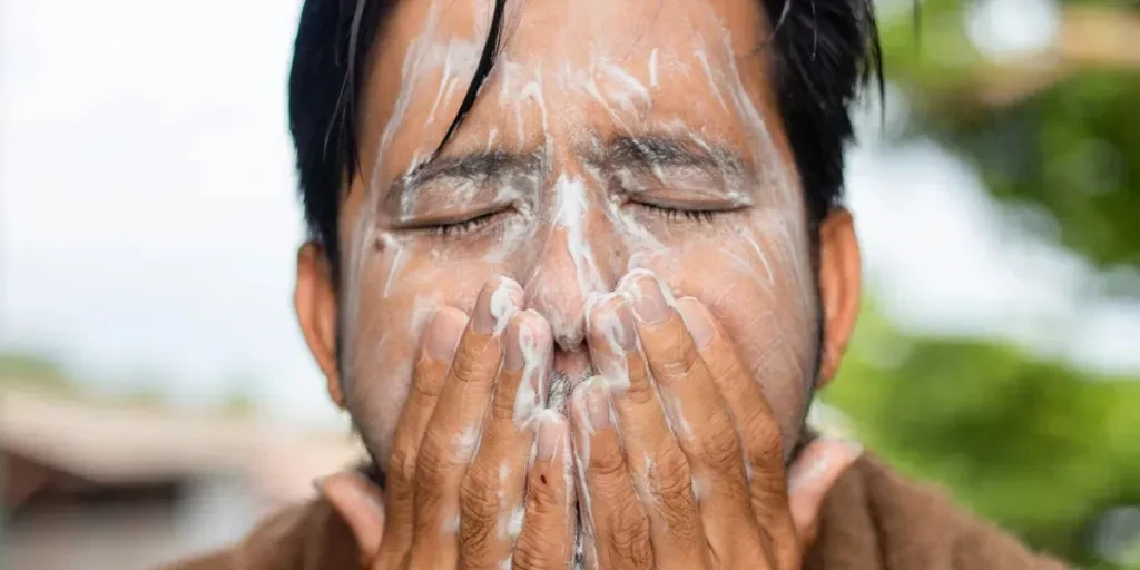 Close-Up Of Man Washing Face