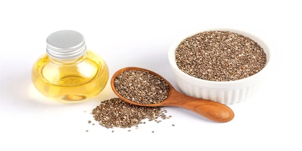 Close up Chia essential oil and seeds in wooden spoon1