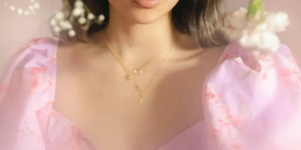 Close-up portrait of a young woman surrounded by delicate flowers, showcasing elegance and grace