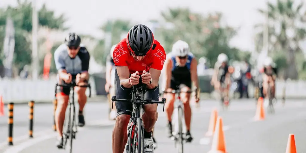 Dynamic shot of cyclists competing in an urban triathlon, showcasing endurance and speed