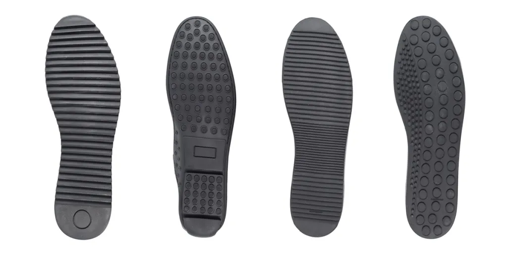 Four black shoe sole in row